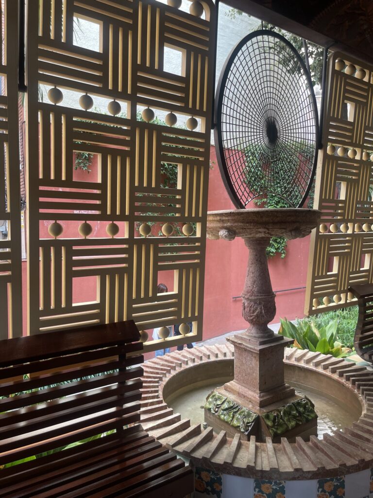 Geometric shutters in garden gallery at Casa Vicens